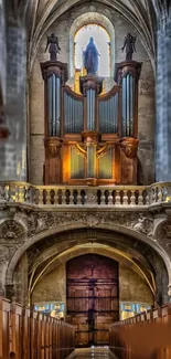 Gothic cathedral interior with grand organ and stone arches.