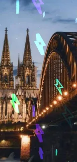 Gothic cathedral and bridge illuminated at night over river.