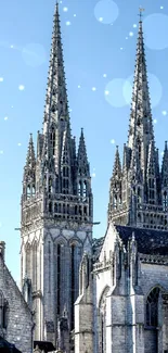Gothic cathedral spires against a clear blue sky.