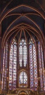 Gothic cathedral interior with vibrant stained glass windows and vaulted ceilings.