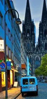 Street view with Gothic cathedral under evening sky.