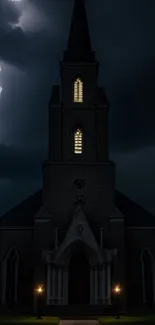 Silhouette of a Gothic church during a lightning storm at night.