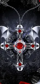 Gothic silver cross with red gems and roses on dark background.