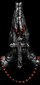 Gothic metal cross with red beads on dark background wallpaper.