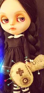 Gothic doll holding a voodoo art figure.