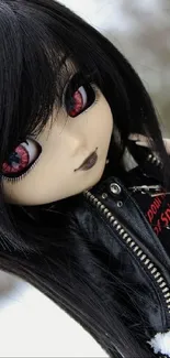 Gothic doll in black leather jacket and red accents, snowy background.