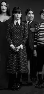 Gothic family portrait in black and white, featuring elegant attire.