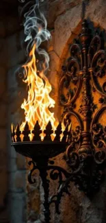 Gothic wall sconce with flame and intricate design.