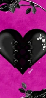 Gothic black heart with roses on pink background.