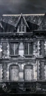 Gothic mansion under dark skies with rain-drenched facade.