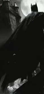 Gothic silhouette of a superhero against a full moon.