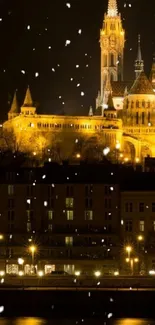 Snow falling around a beautiful illuminated castle at night.