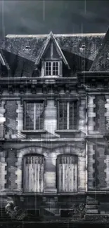 Mobile wallpaper of a gothic mansion in the rain under a dark sky.