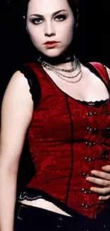 Gothic style woman in red corset and black attire.