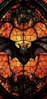 Gothic stained glass with bat design in orange hues.