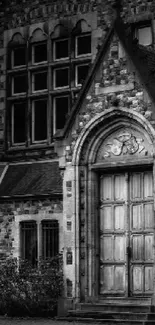 Gothic stone doorway with arched entrance in monochrome.