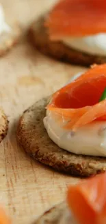 Gourmet appetizers with smoked salmon and cream on crackers.