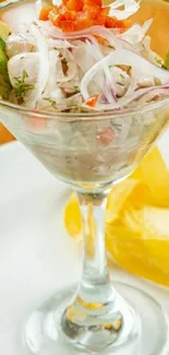 Gourmet ceviche served in a martini glass with garnishes.