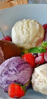 Colorful ice cream scoops with fruits on a plate.