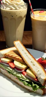 Gourmet sandwich with smoothies and strawberries.