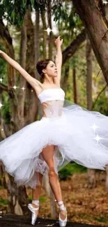 Ballerina in a white tutu dances gracefully in a forest setting.