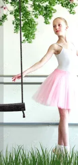 Young ballerina in pink tutu with swing and greenery.