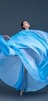 Dancer in flowing blue dress in motion.