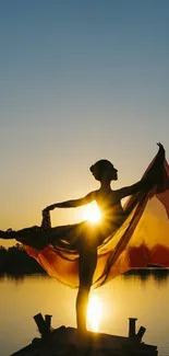 Silhouette of a dancer at sunset on a lakeside.