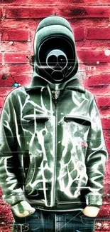 Masked figure in graffiti jacket on red brick wall.