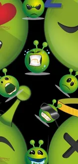 Green alien emojis with fun expressions on a black background wallpaper.