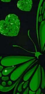 Green butterfly with crystal hearts on dark background.