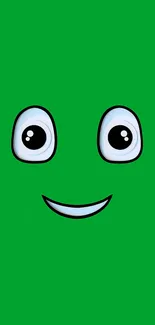 Simple green cartoon face with big eyes and a smile.