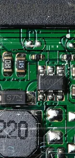 Close-up of a green circuit board with detailed components and patterns.