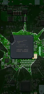 Mobile wallpaper with a green circuit board and broken glass effect.