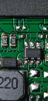 Closeup of green circuit board with components