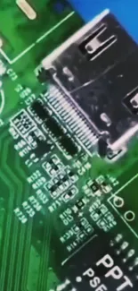 Close-up macro of green circuit board with USB port.