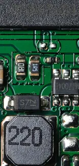 Close-up of green circuit board with electronic components.