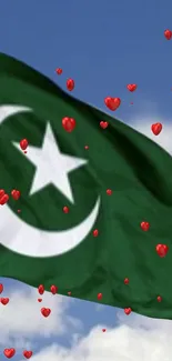 Green flag with crescent and star, red hearts in blue sky.