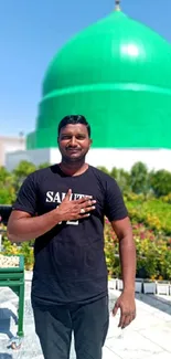 Green dome under a clear blue sky with person in foreground.