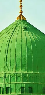 A vibrant green dome with a serene backdrop.