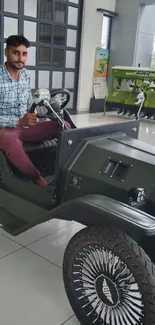 Green electric car in showroom with person seated.