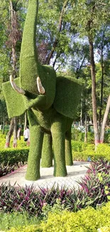 Elephant-shaped topiary in a green garden.