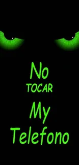 Green glowing eyes with text 'No Tocar My Telefono' on black background.