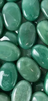 Emerald green gemstones clustered together.