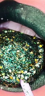 Close-up of green glitter lips with a sparkling lollipop.