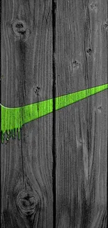 Green swoosh logo on dark wooden background.