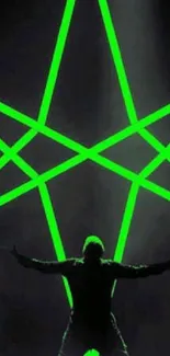 Silhouette in front of a large neon green star.