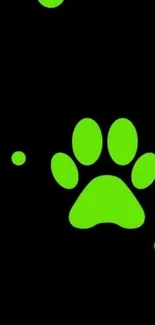 Green paw print wallpaper with black background.