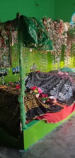 Vibrant green shrine with floral decorations and colorful fabrics