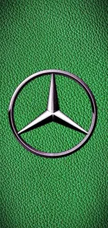 Green textured wallpaper with Mercedes logo.